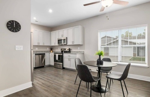 Grandville Apartment | Modern 16BR 16BA Condos w Garage and Patio