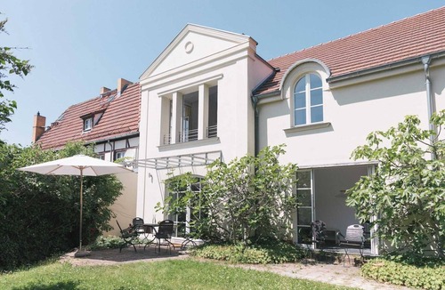 Werder Apartment | REMISE STUDIO: Garden view, balcony and water access