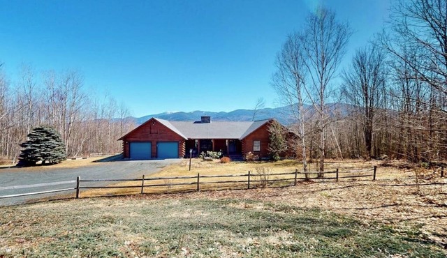 Custom log home with enormous deck & stunning mountain views