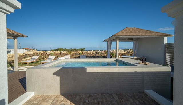 Serene, air-conditioned two-bedroom villa with plunge pool and ocean views.